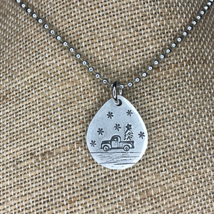 Snowy Winter Truck Carrying a Christmas Tree Necklace