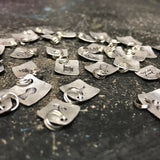 Tiny Hand Cut Metal Stamped Footprint Pendant Charm